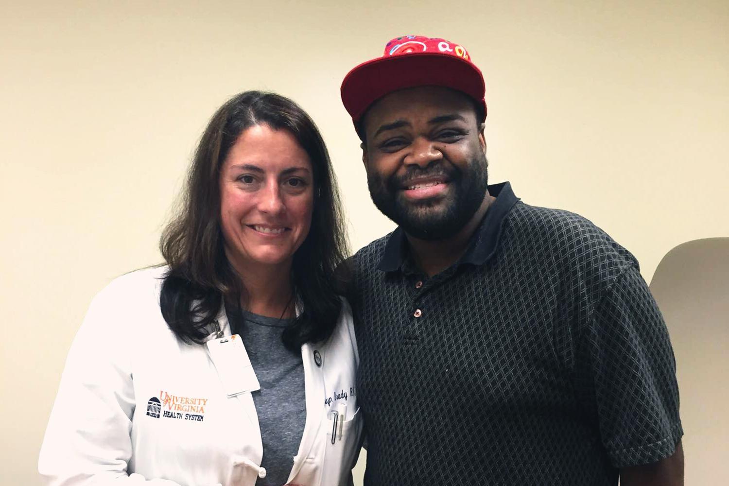 Nurse practitioner Carolyn Brady meets with patient Jason Dent, who was able to attend his college graduation ceremony a few weeks after being treated for heart failure.