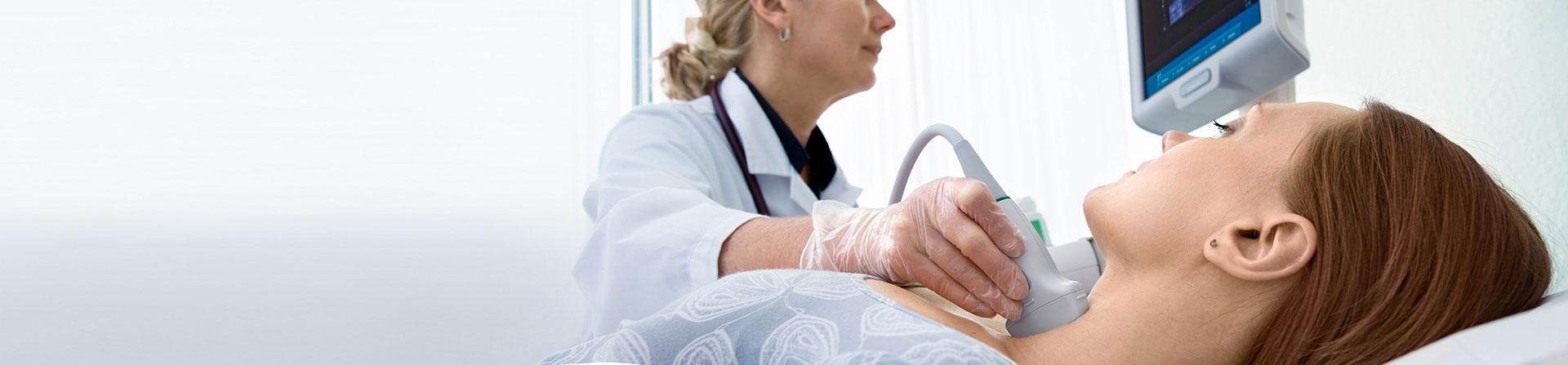 patient receiving an ultrasound on her neck