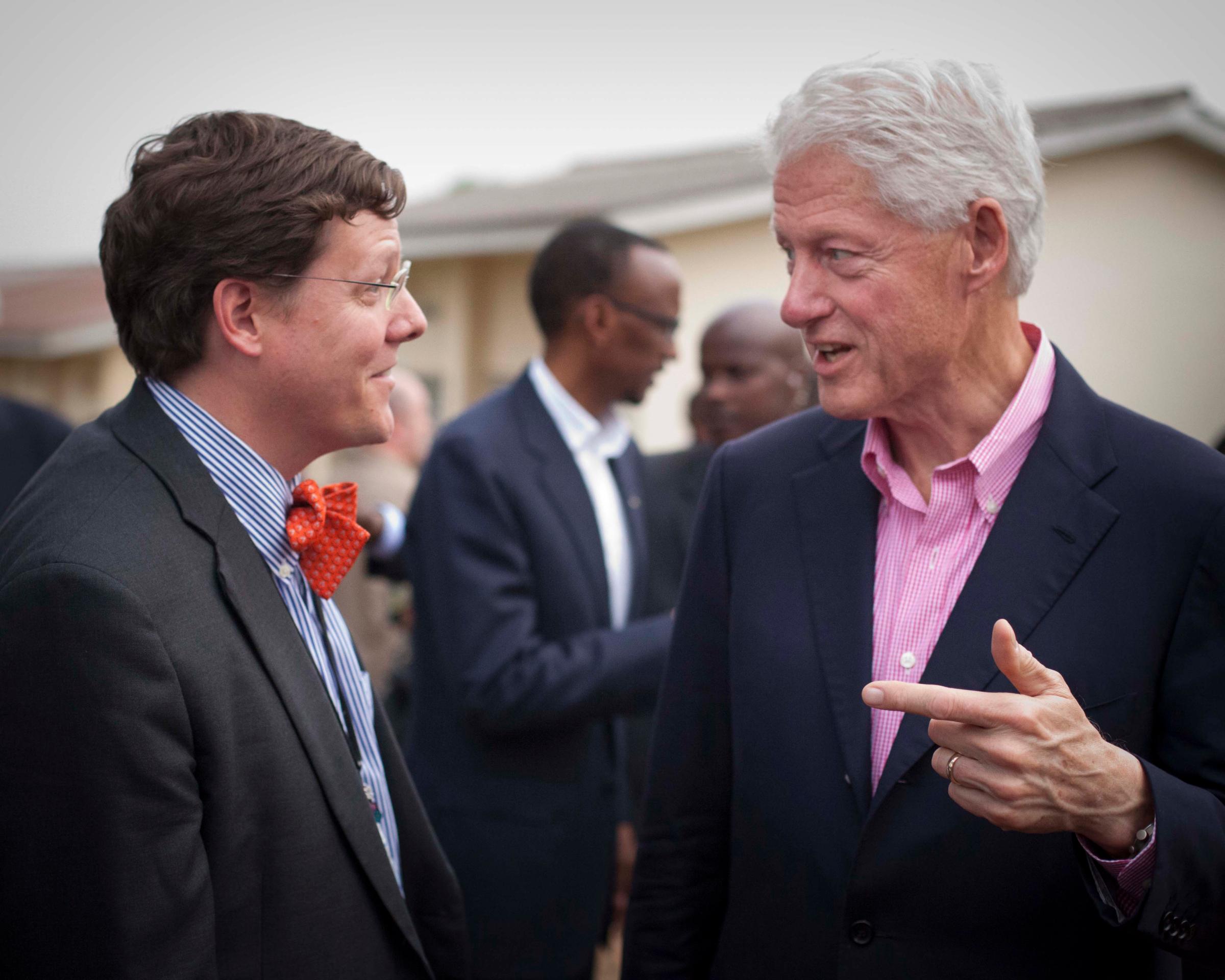 Forrest Calland, MD, and former President Bill Clinton (Photo credit: Patrick Kyamanywa)