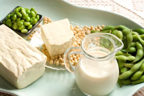 Soybeans, tofu, and milk are on a serving dish as natural alternatives to statins