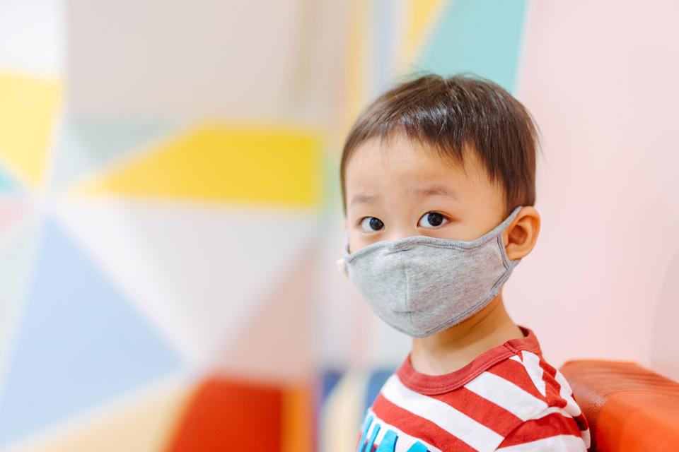 Young child wearing face mask